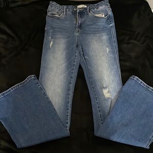 Flare blue jeans with rips on the legs